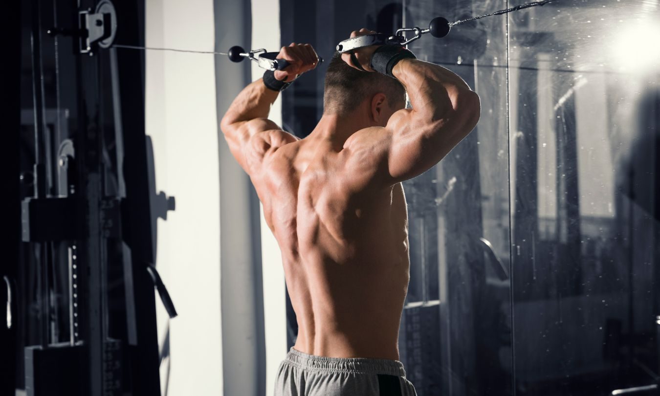 bodybuilder doing the good morning exercise