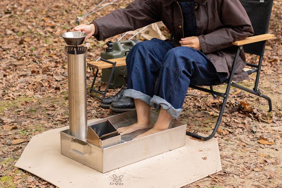 Person using a DOD Outdoors Rocket Submarine Footbath outdoors.