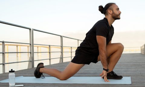 Man stretching his hip flexors