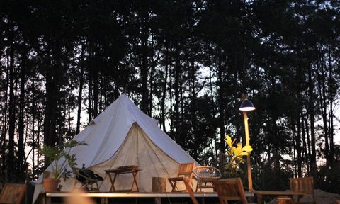A fancy glamping setup at dusk