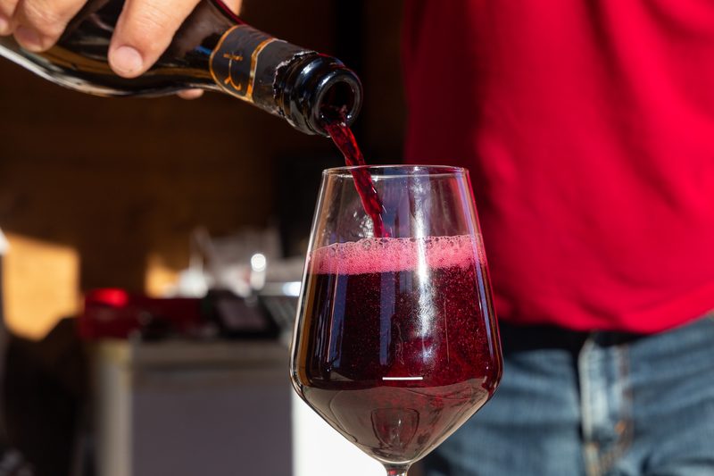 Lambrusco wine being poured into a glass