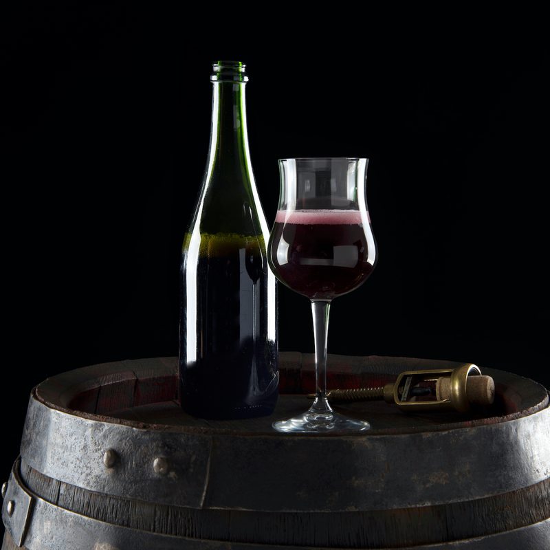 Lambrusco wine barrel with carafe and wine glass