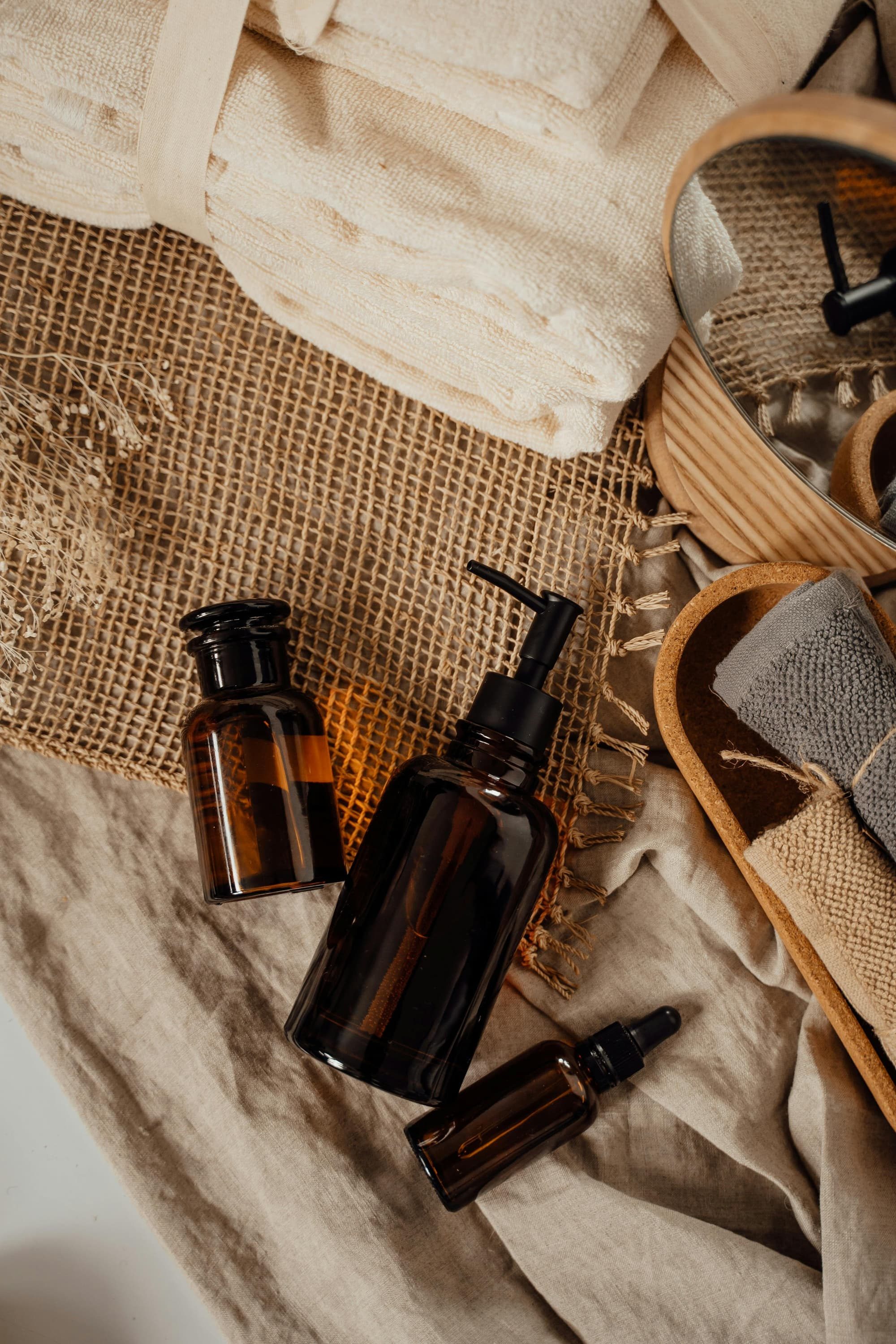 brown bottles on rustic cloth