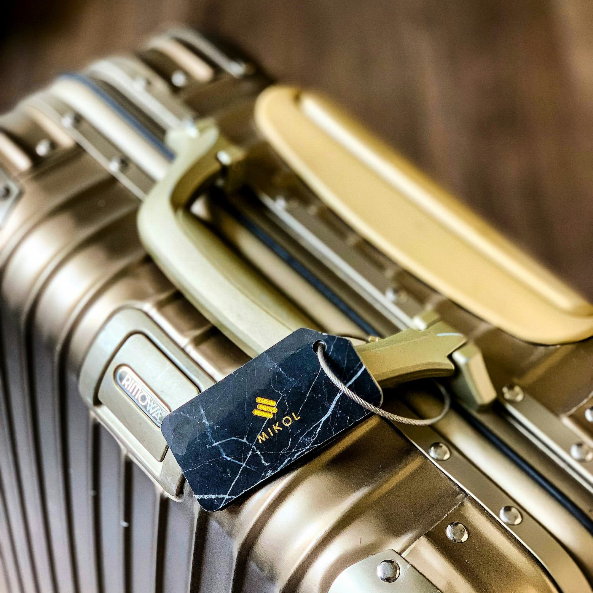 suitcase with a marble luggage tag