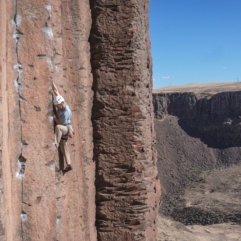 Rock climber with helmet