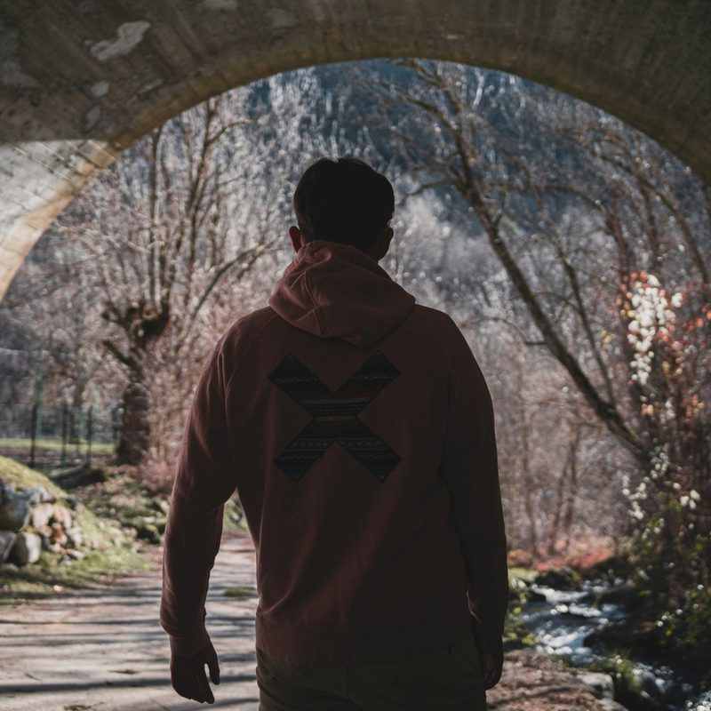man in a hoodie in tunnel