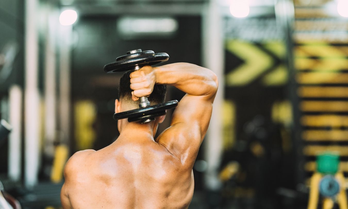muscular man with free weights