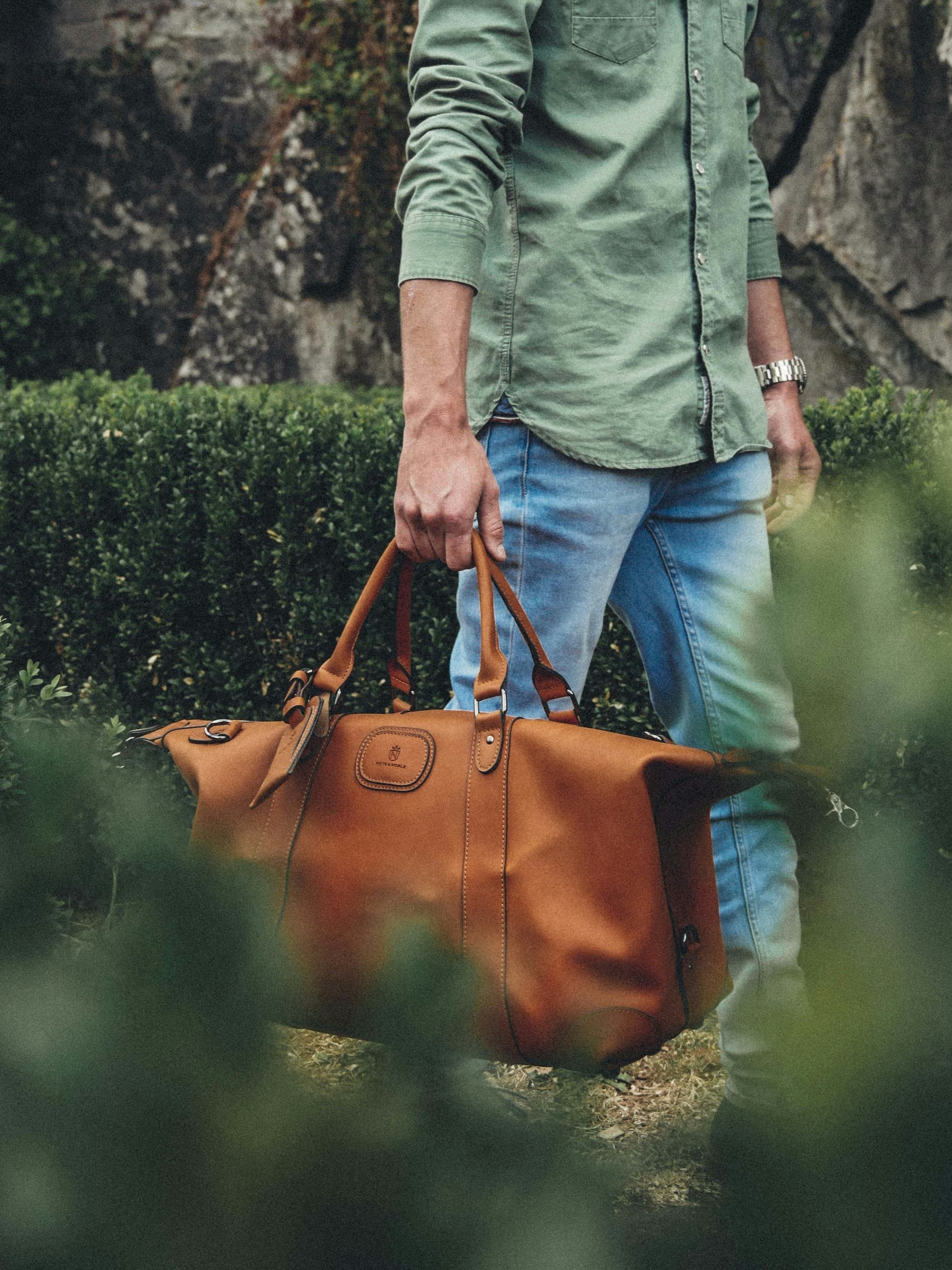 man holding a brown bag