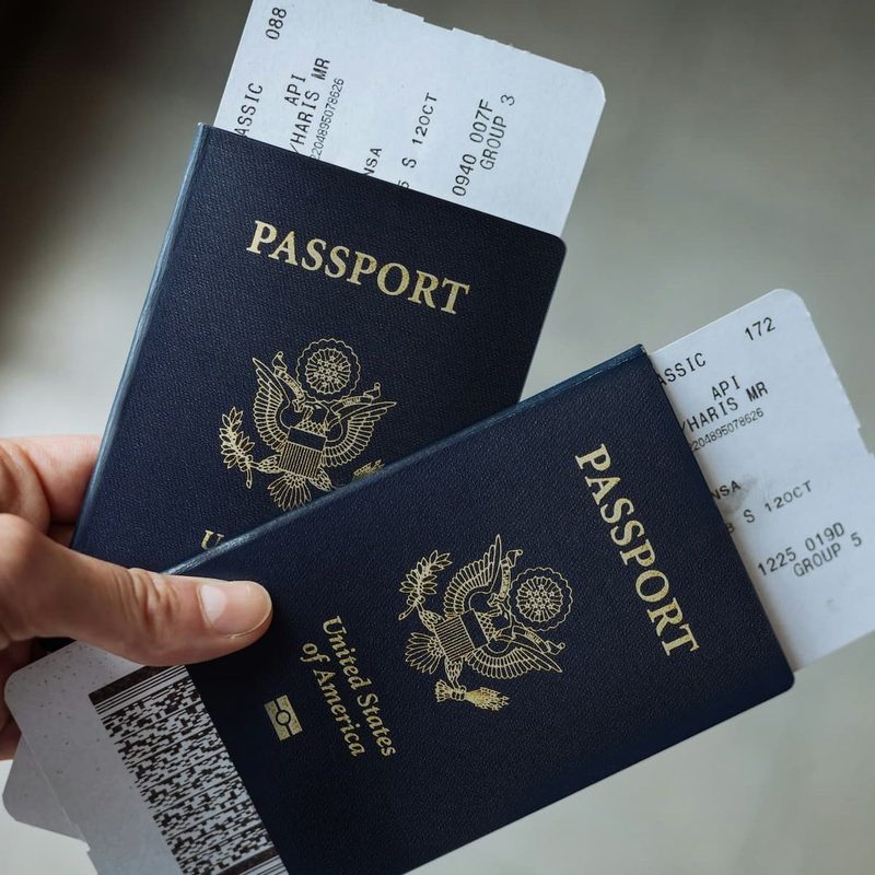 Hand holding two U.S. passports