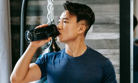 Man drinking supplement
