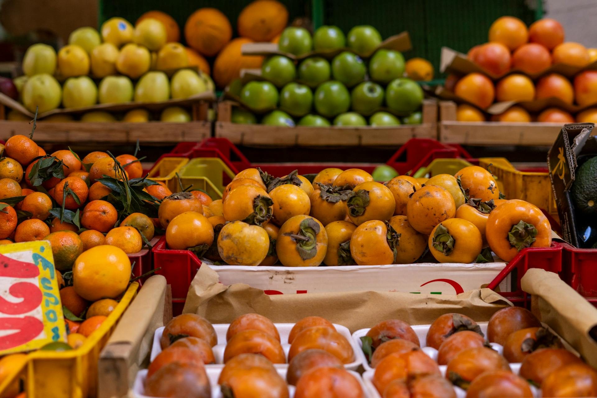 Table of fall fruit including persimmons and citrus