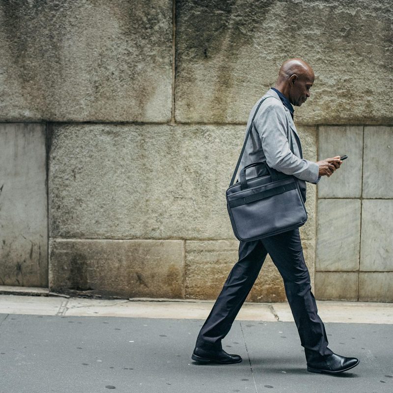 Man walking wearing suit and boots