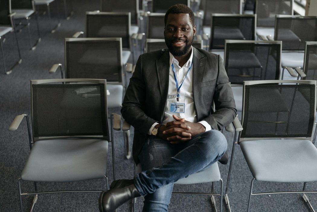 man wearing shirt, blazer, jeans and cowboy boots