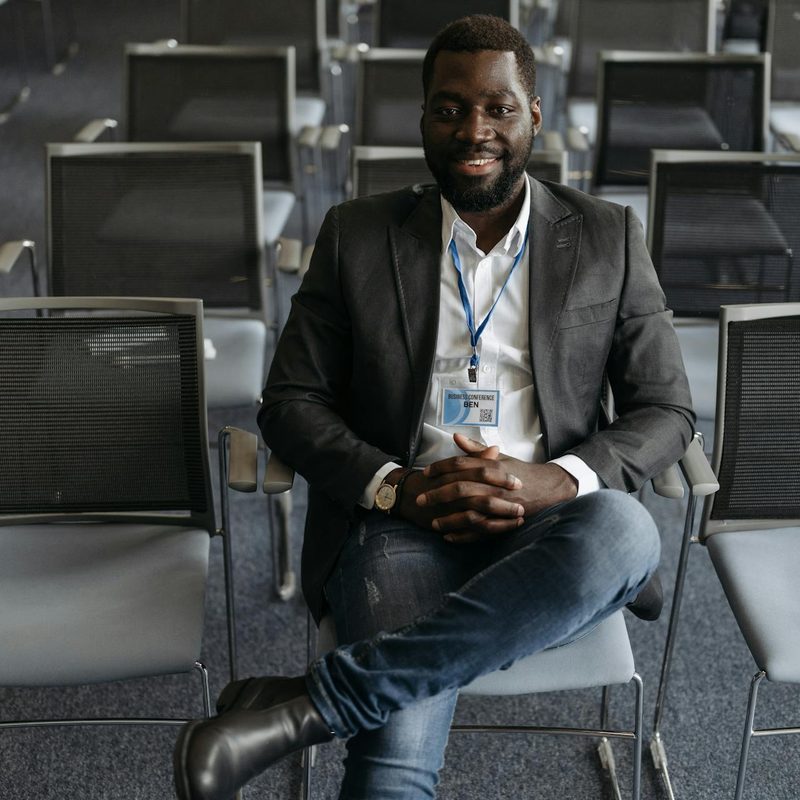 Man wearing shirt, blazer, jeans and cowboy boots