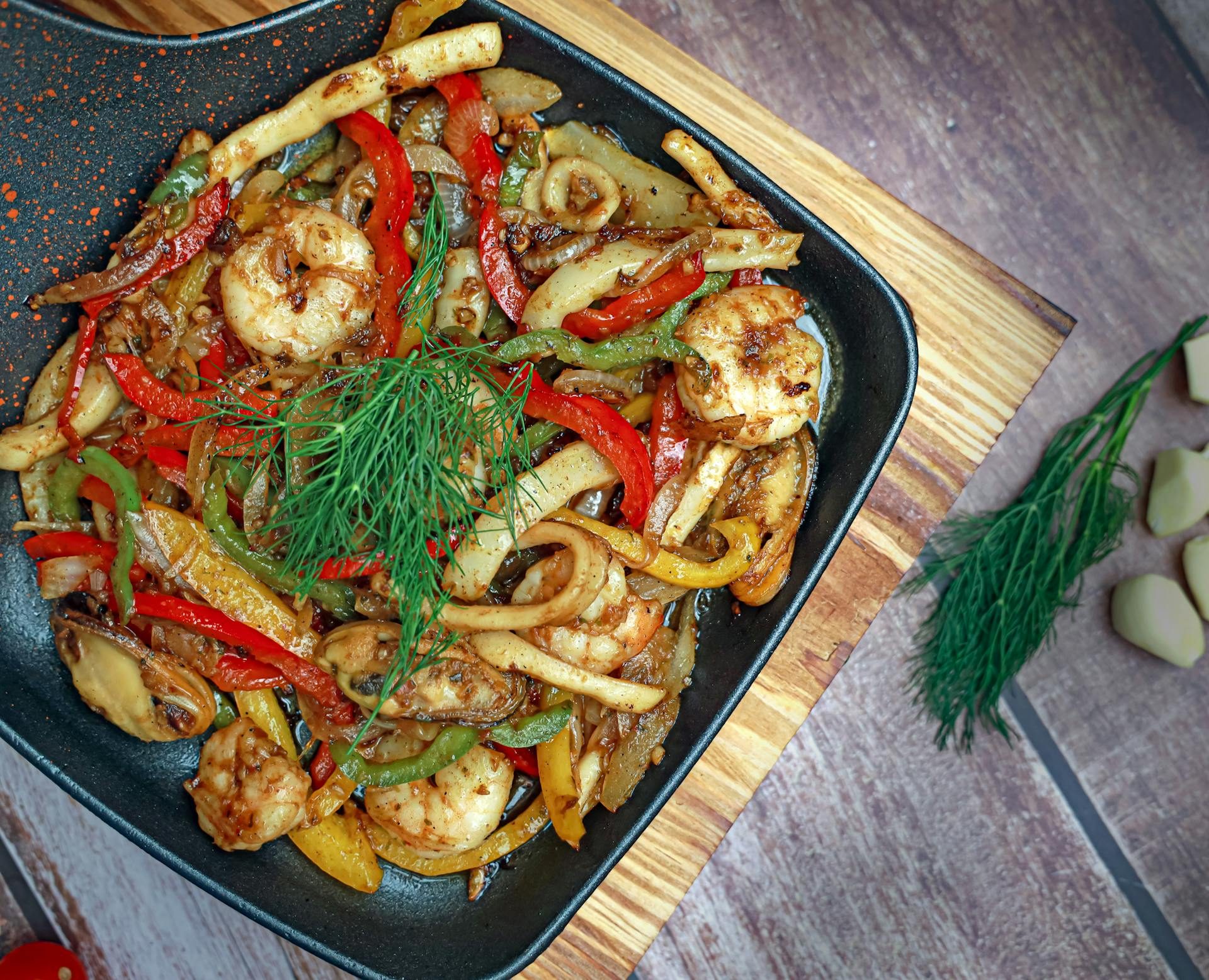 Pan with cooked shrimp and vegetables