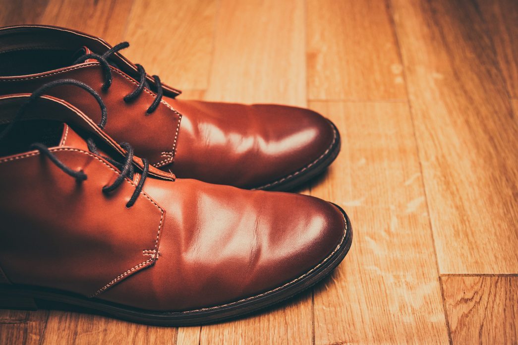 brown chelsea boots on wood floor