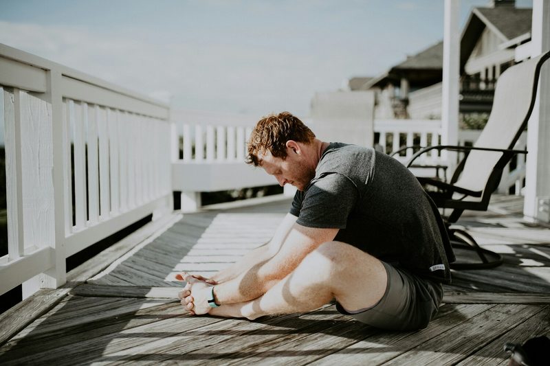 Man doing butterfly stretch