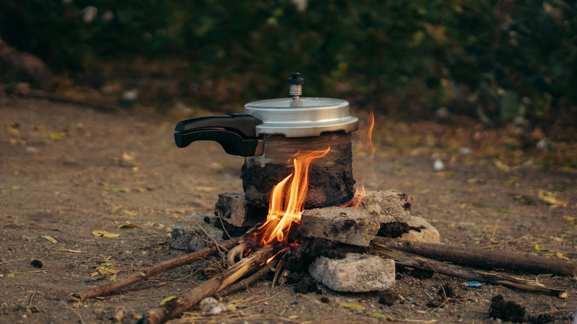 Pressure cooker over a camp fire