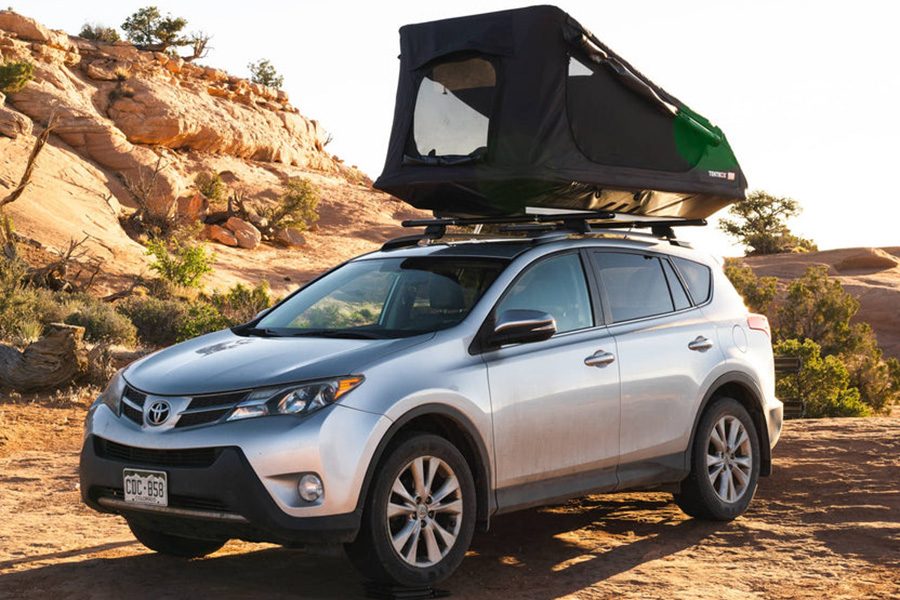 TentBox GO rooftop tent installed on a Toyota SUV parked in the desert.