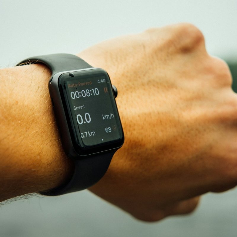 Close-up of a man wearing an Apple Watch on his arm, health and fitness app
