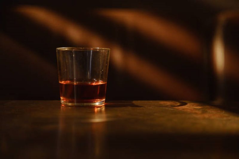 Whiskey in a glass in a dark room