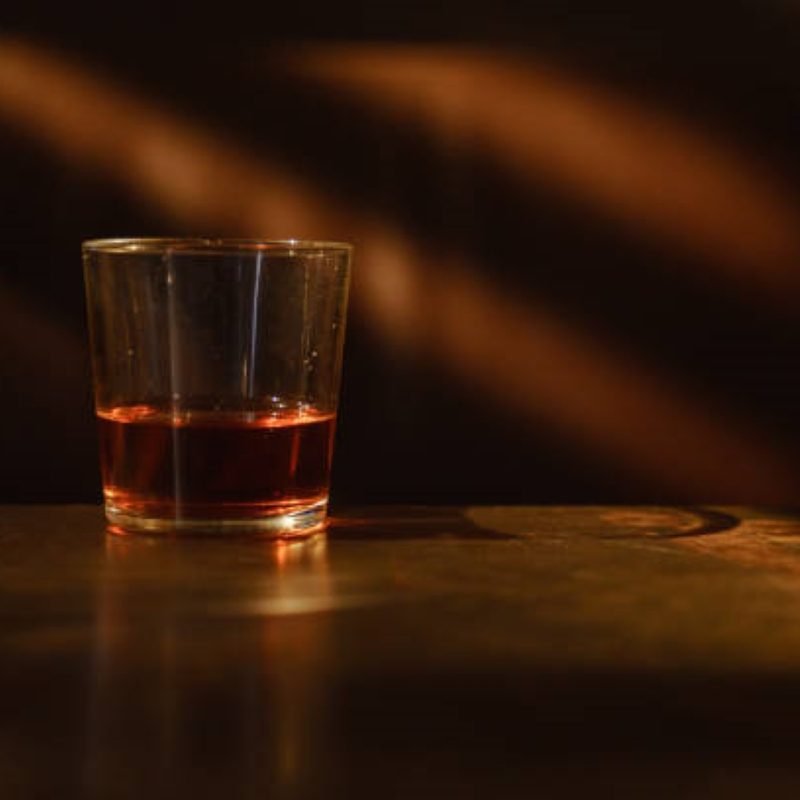 Whiskey in a glass in a dark room