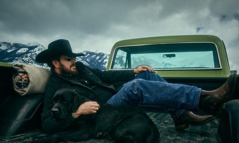 Cole hauser laying next to dog in truck bed