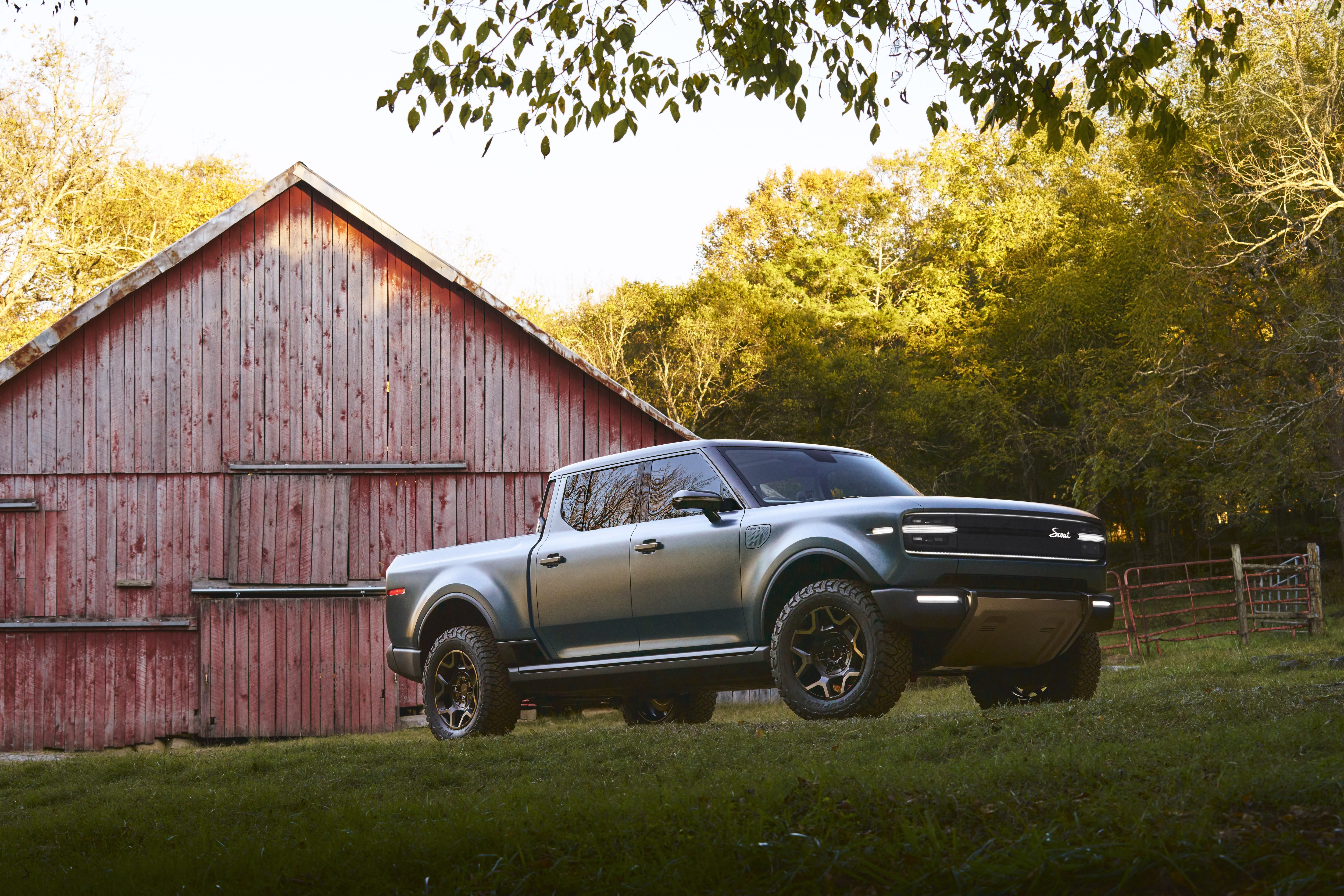 Scout Motors Terra truck in front of barn