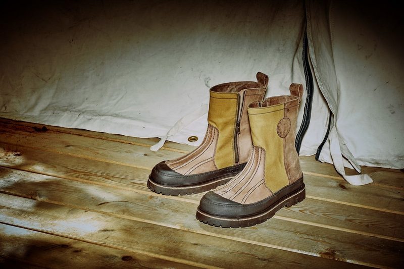 birkenstock x filson boots sitting on wood floor in tent