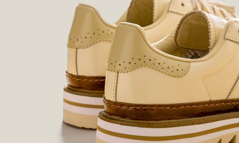backside of the adidas superstar sneaker in tan