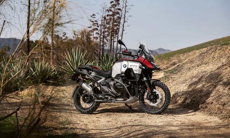 2025 BMW R 1300 GS Adventure right side view parked on a dirt road in the mountains.