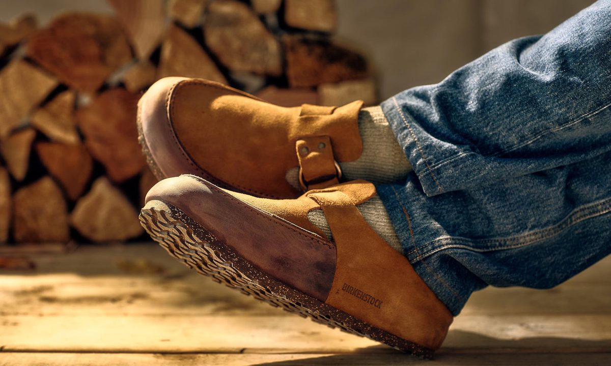 man wearing birkenstock and filson mule