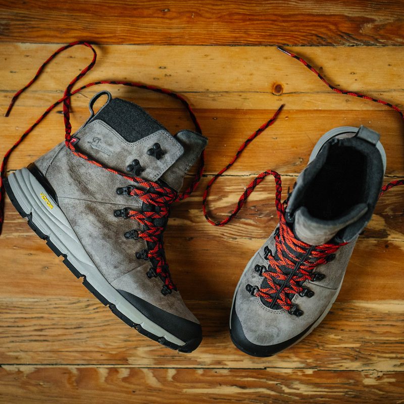 danner arctic grey boots on wood floor