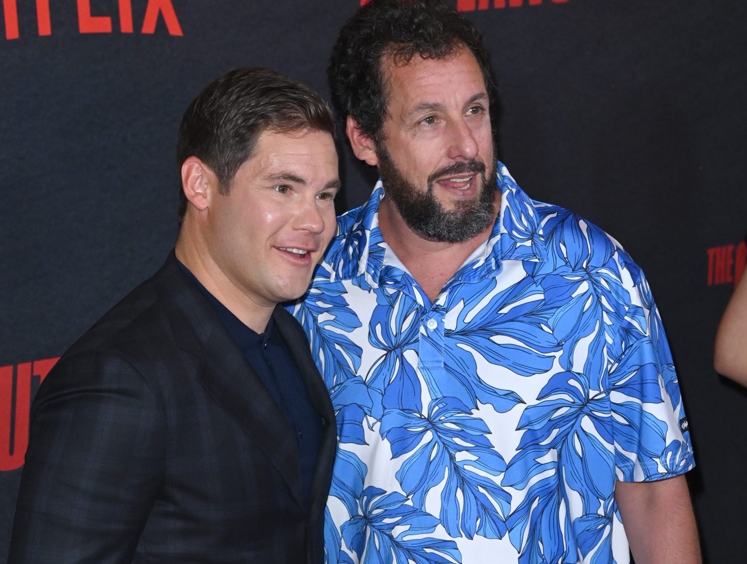 Adam Sandler with Adam DeVine at movie premier