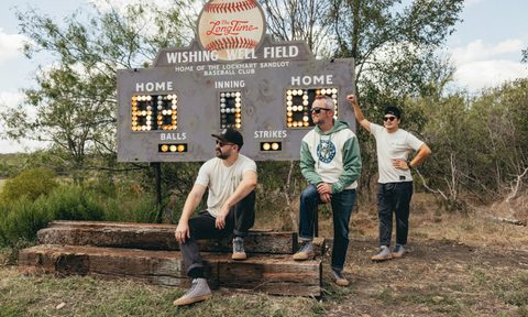 Baseballism_P.F. Flyers three guys by a scoreboard
