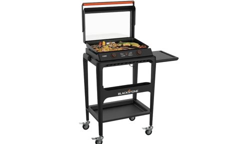 Food on a Blackstone E-Series 2-Burner 22-inch Electric Tabletop Griddle with Prep Cart.