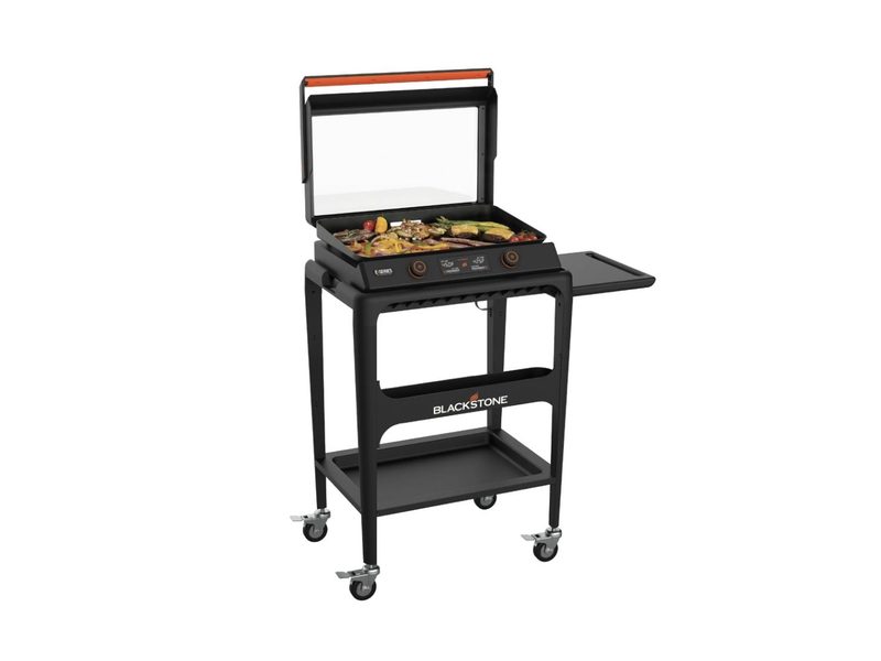 Food on a Blackstone E-Series 2-Burner 22-inch Electric Tabletop Griddle with Prep Cart.