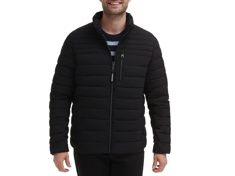 A model wearing the Calvin Klein Lightweight Puffer Water-Resistant Down Men’s Jacket.