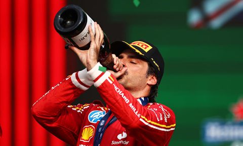 Carlos Sainz drinks from the champagne magnum after winning the 2024 Mexico City Grand Prix.