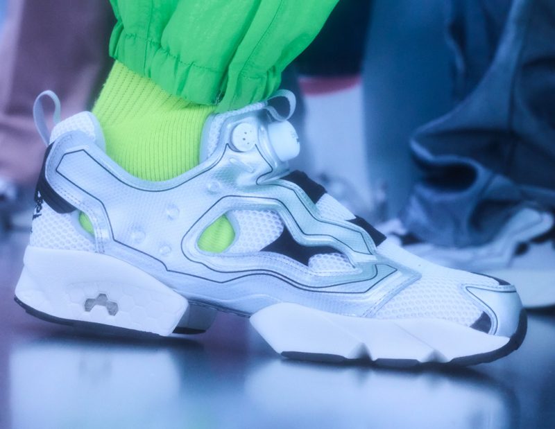 model wearing new beams x reebok sneakers