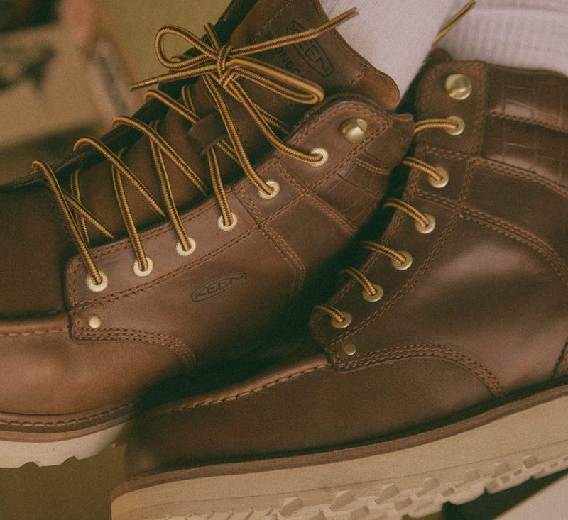 person wearing keen noon goon boots with white socks