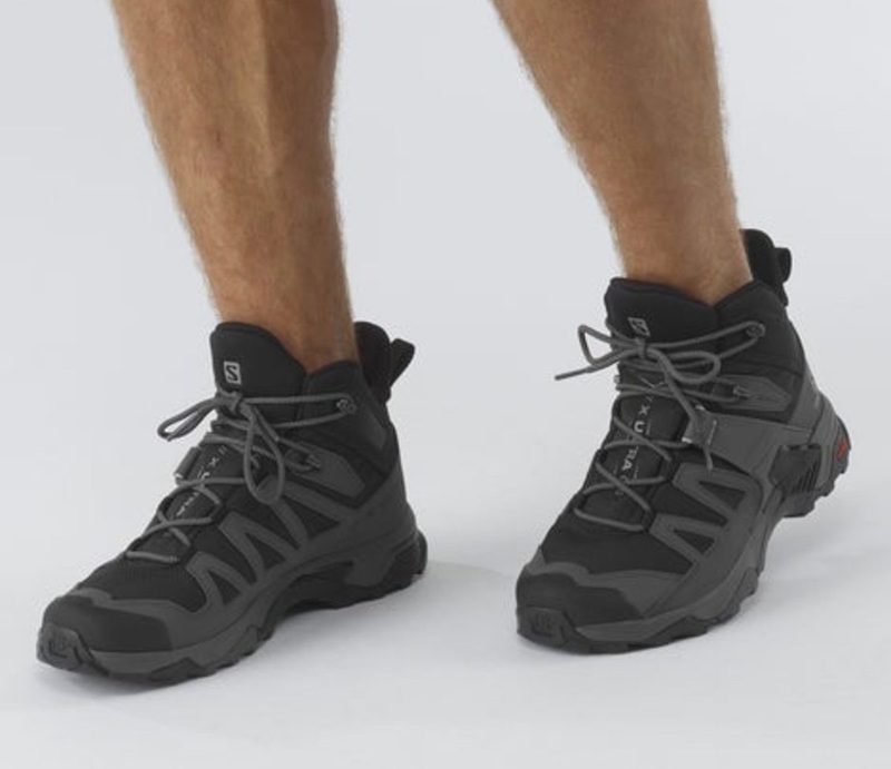 salomon grey hiking boots on model