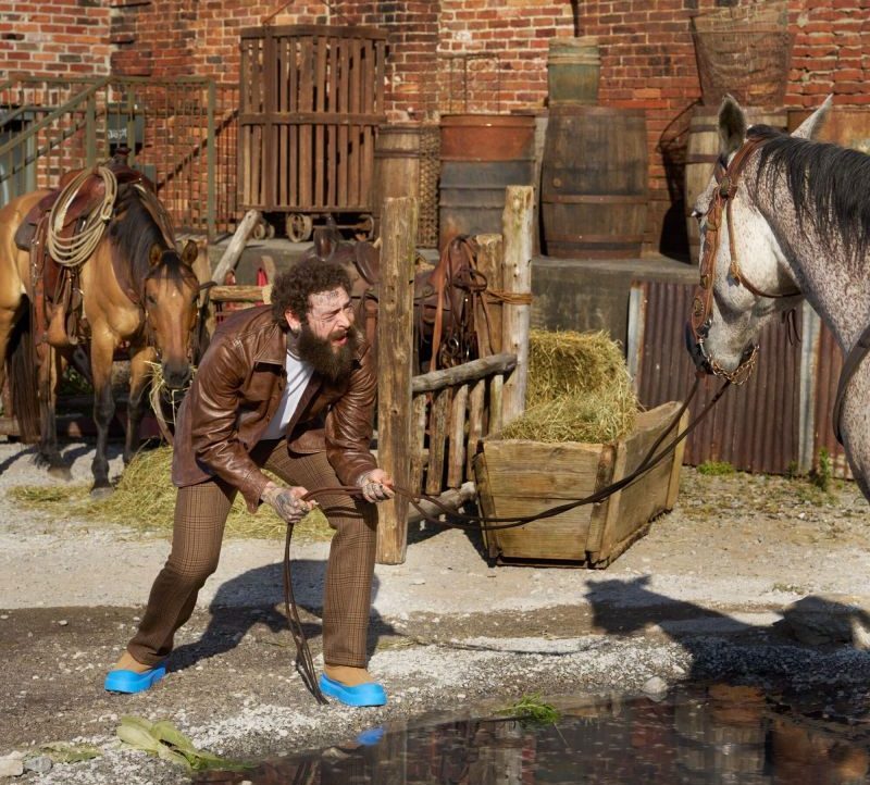 post malone standing to horse wearing new ugg boots