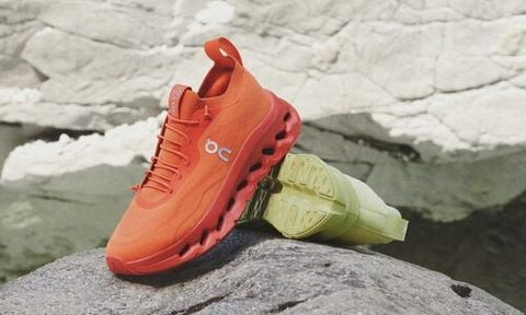 bright orange and neon green sneakers on rock
