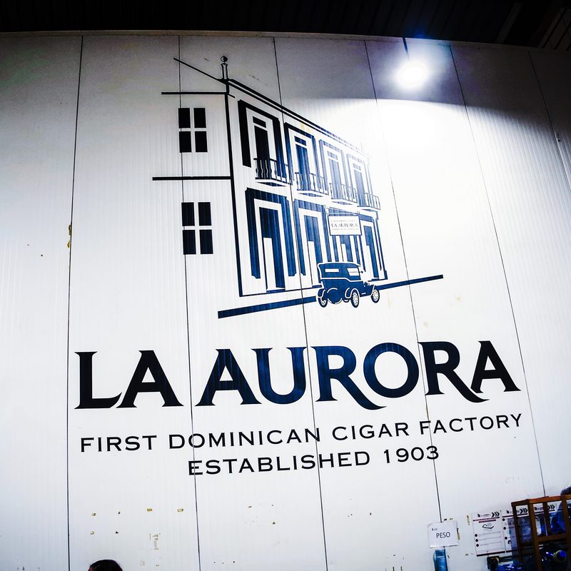 La Aurora factory logo on the big wall inside the tobacco room -- The Manual Briley Kenney