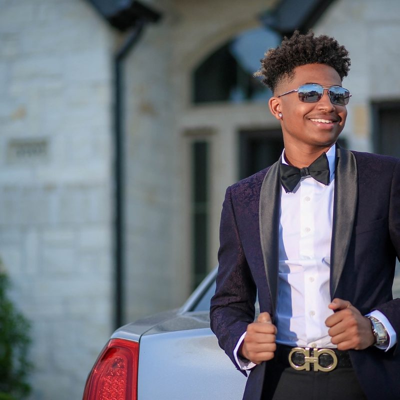 Man in a tuxedo and sunglasses