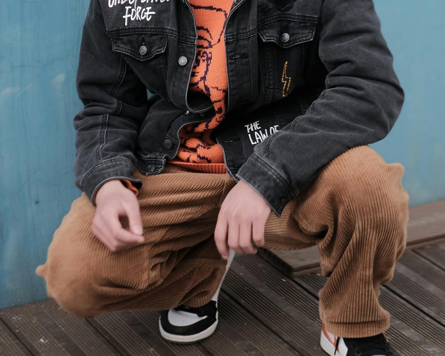 Man kneeling in corduroys
