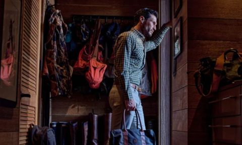 Man looking out the door in Tom Beckbe