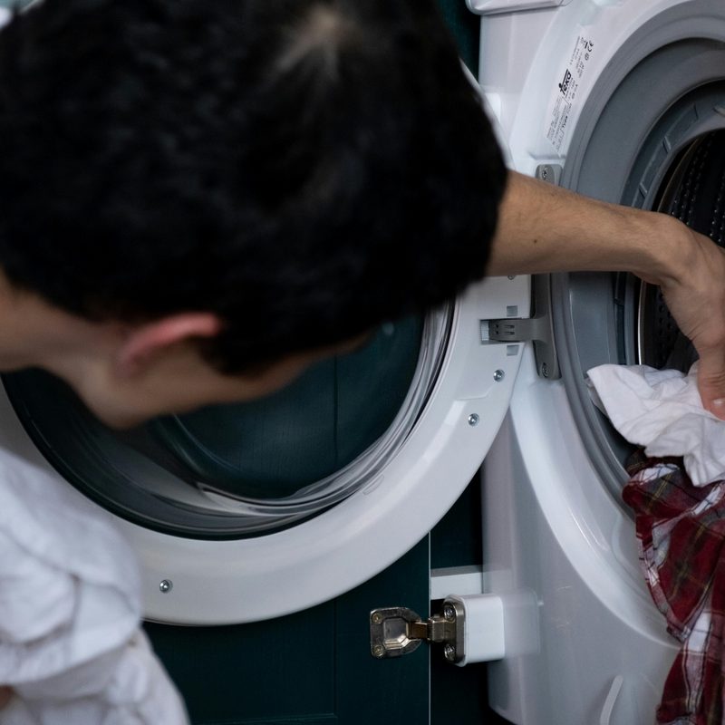 Man reaching in a dryer