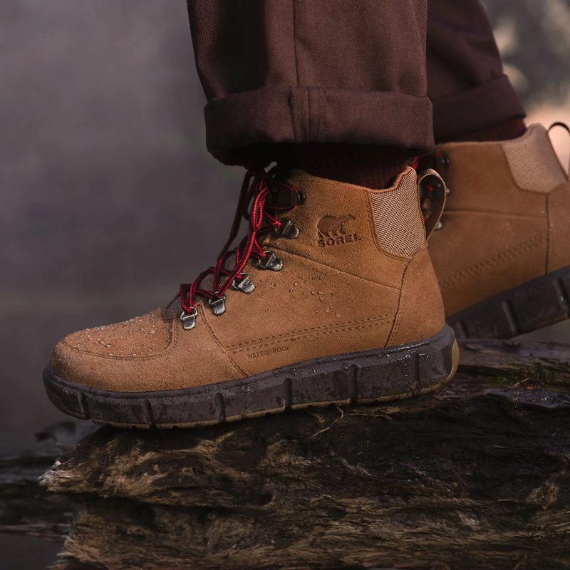 sorel brown boots on log
